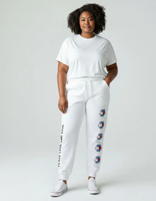 Tommy Jeans női melegítő nadrág fehér – Peace Smiley track pants